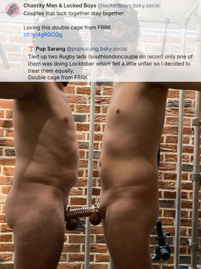 Couple of Rugby boys naked and tied spread eagles to a scaffolding cage. They are joined at the cock by A chastity device from the brand FRRK that is a double cage designed for two people to wear together. They are in a dungeon space with brick walls. 