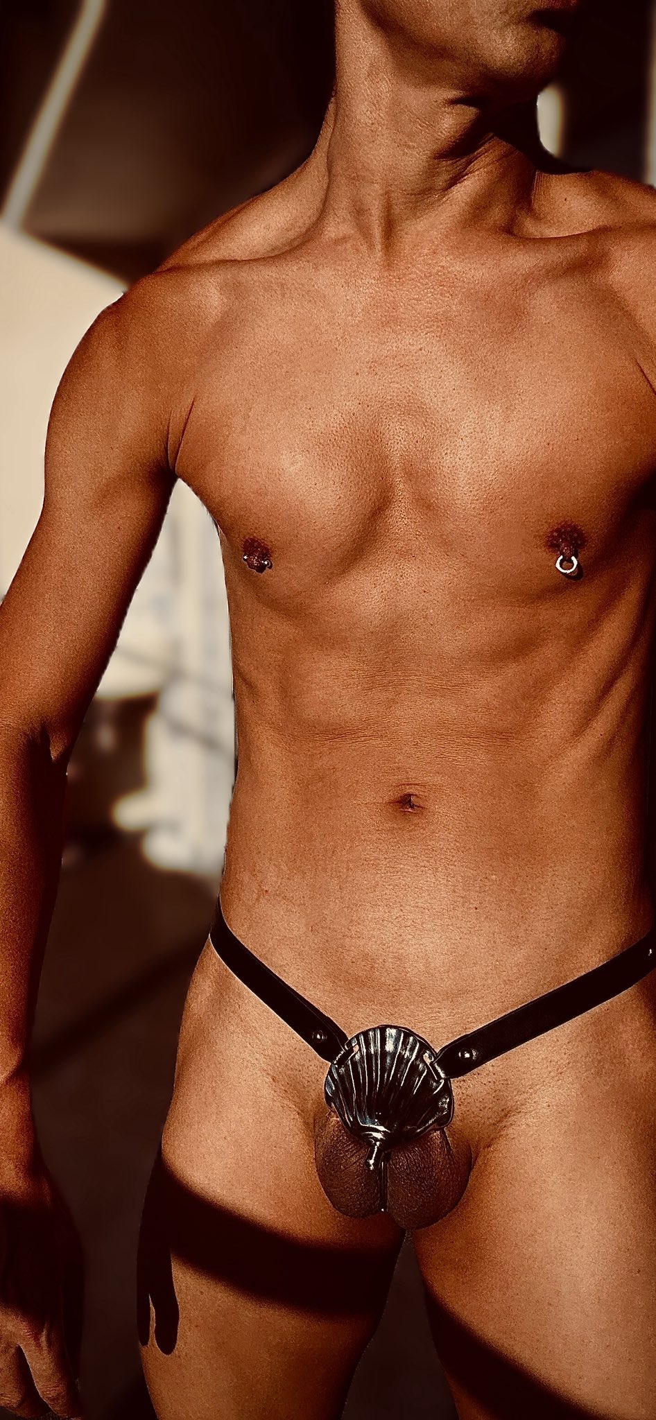 Twitter User: LockedAlpha wearing the Shell Invisible Chastity Cage | F277